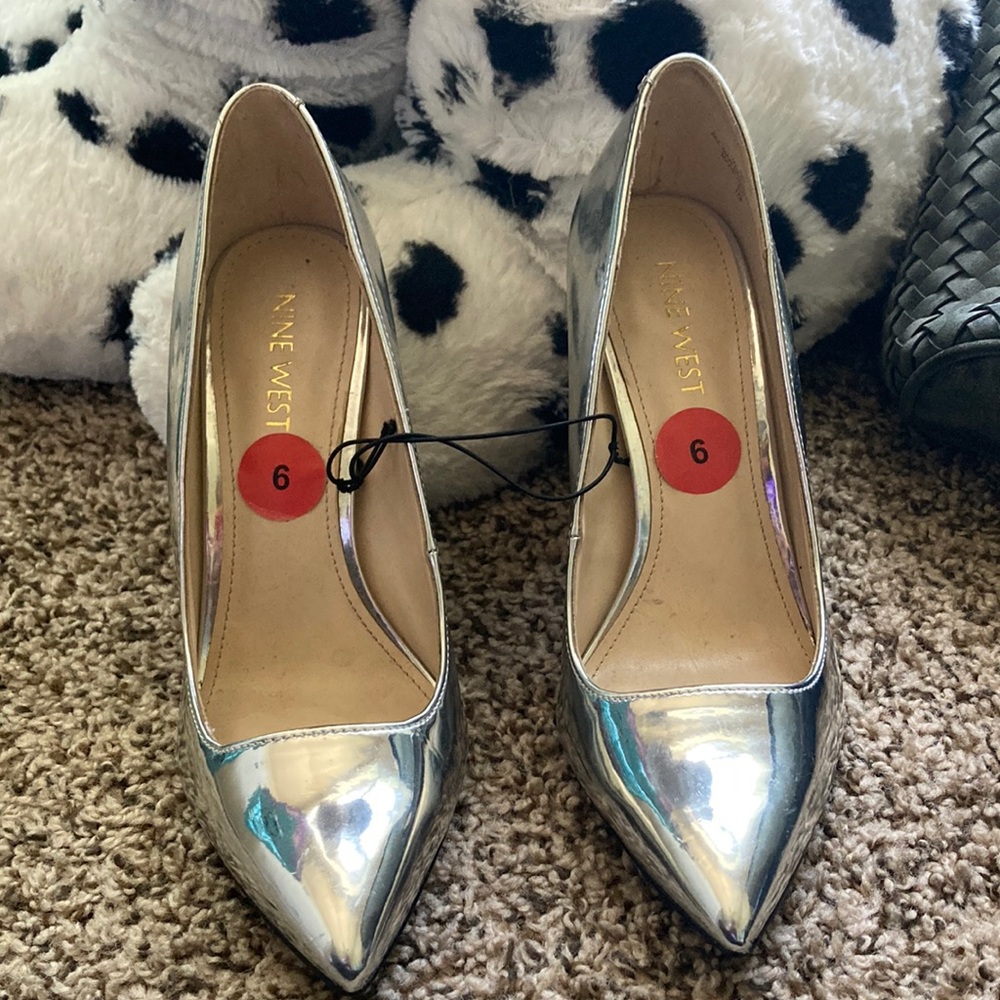 Never worn,Nine West, silver metallic, 3 inch heel.